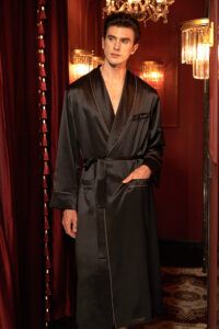 Elegant Rome Men's Black Silk Robe with a luxurious sheen, worn by a model in a sophisticated setting.