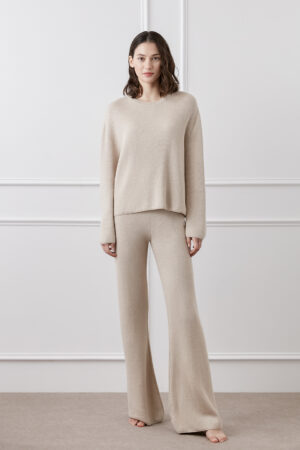 Woman wearing Mellow Silk-Wool-Cashmere Lounge Set in sand taupe, featuring relaxed fit and soft textured knit.