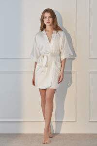 Woman in a Wedding Whisper Silk Short Kimono with elegant wide sleeves and waist tie detail.