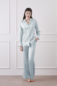 Full-body view of Resort Women's Pajama Set in Blue, styled with lapel shirt and wide-leg silk pants for a chic relaxed look.