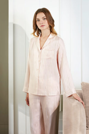 Elegant Faery Women's Pajama Set in soft peach with vertical stripes, featuring a classic button-up shirt and matching pants.