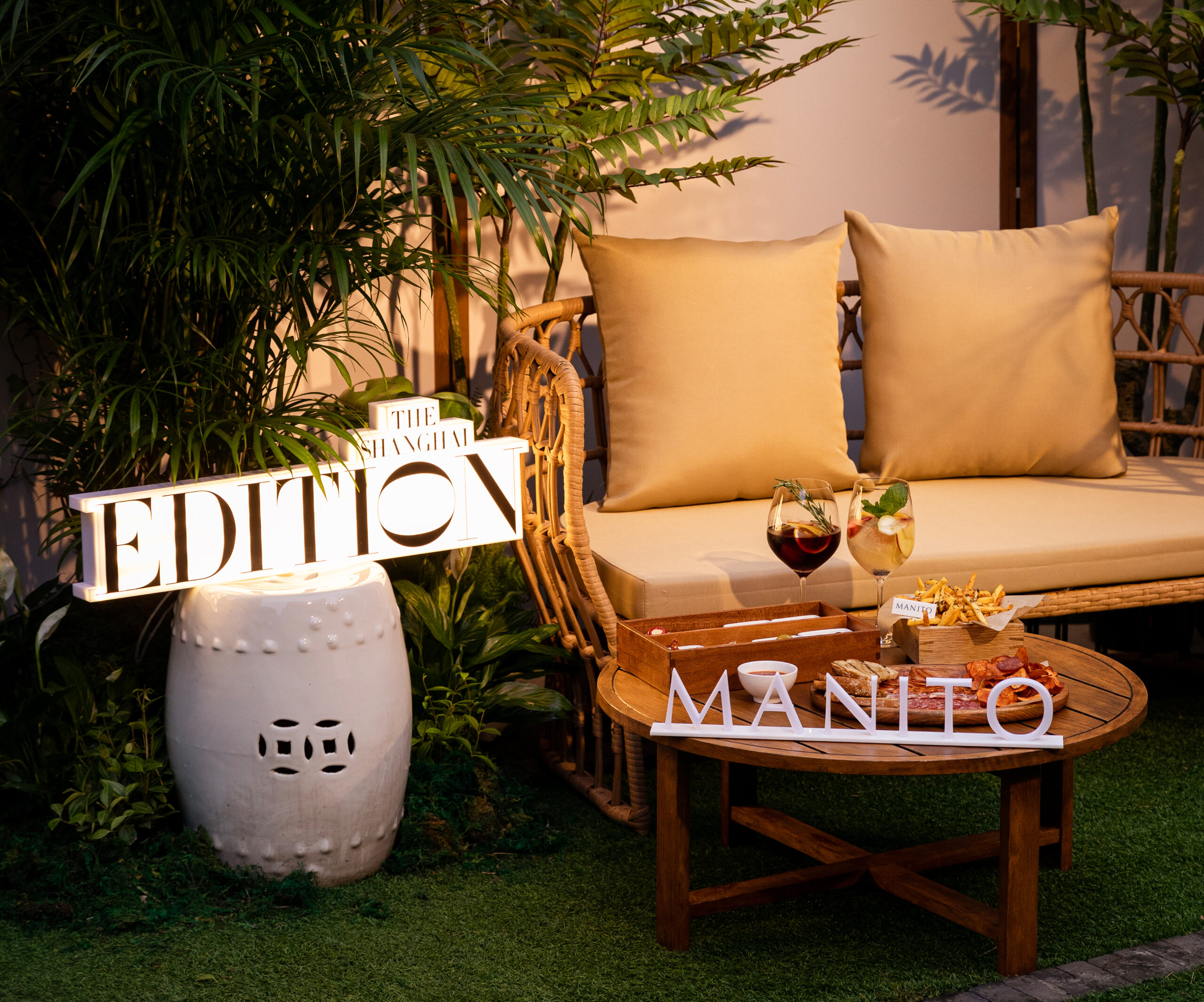 The EDITION Hotel's Roof Garden set for MANITO's 520 Party, featuring luxurious silk cushions for a summer celebration of love.