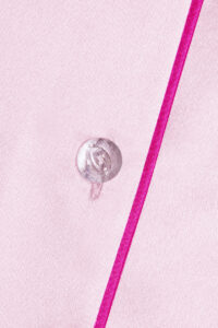 Elegant Macaron Silk Pajama Set featuring a smooth texture and delicate button design.