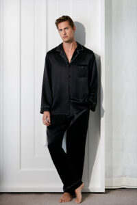Full-length view of a man wearing the black MANITO Noir Ruban Men's Silk Pajama Set.
