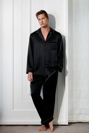 Full-length view of a man wearing the black MANITO Noir Ruban Men's Silk Pajama Set.