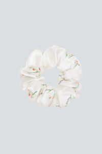 Close-up of Princess Louise Silk Scrunchie with delicate floral patterns.