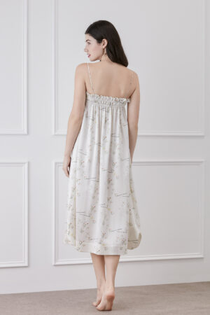 Back view of a woman wearing Princess Louise silk slip dress showing the design on the back of the dress.
