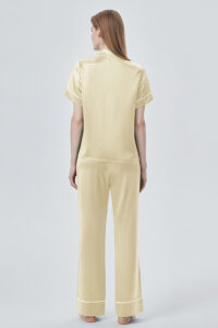 Back view of yellow MANITO Authentic Short Sleeve Pajama Set, revealing fluid silk drape and neat finish.