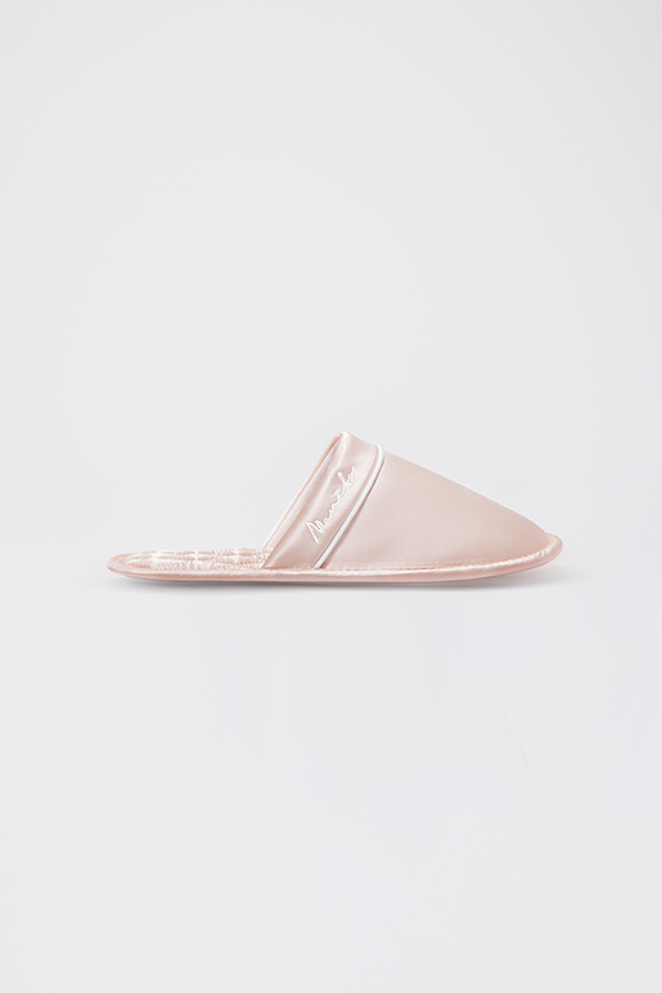 Side view of pink Authentic Women's Silk Lounge Shoes, showing sleek mule silhouette with quilted footbed.