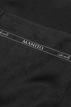 Close-up of the MANITO Noir Ruban Silk Pajama Set's distinctive logo-patterned trim, featuring "Silk Moments" text.