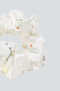 Detailed close-up of Princess Louise Silk Scrunchie featuring intricate floral design.