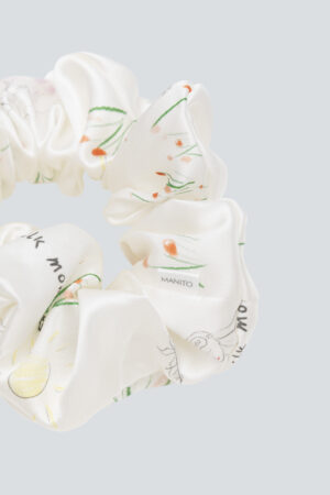 Detailed close-up of Princess Louise Silk Scrunchie featuring intricate floral design.