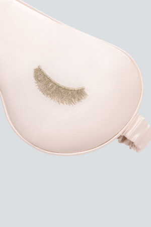 Detailed view of the gold eyelash embroidery on Lash Contour Silk Eye Mask, showing a refined accent for luxurious appeal.