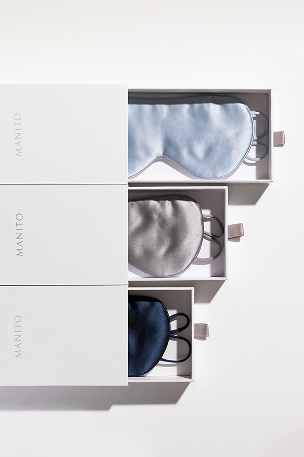 Cozy Silk Eye Masks in white gift boxes, showcasing elegant packaging and soft silk texture.