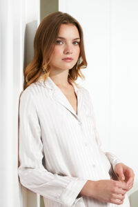 Close-up of MANITO Faery Women's Pajama Set in ivory with silky jacquard stripe pattern.
