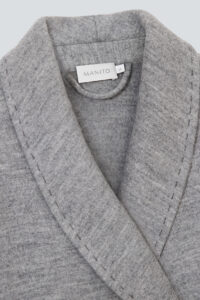 Detail shot of MANITO Bomber Men's Knit Robe fabric, showing wool-silk blend texture and precise stitching.