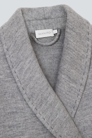 Detail shot of MANITO Bomber Men's Knit Robe fabric, showing wool-silk blend texture and precise stitching.