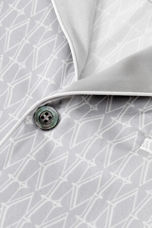 Close-up view of Classic Monogram Men's Silk Pajama with Button Detail.