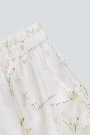 Close-up of Princess Louise short pajama set shorts, complete with ruffles and floral patterns.