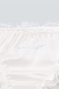 Detail view of Coucou Women's 2pcs Silk Briefs showing lace edge and embroidery.