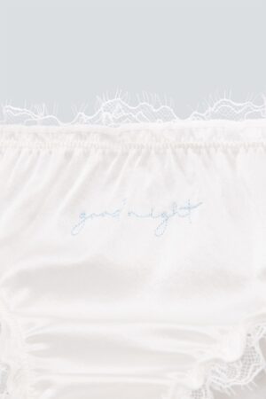Detail view of Coucou Women's 2pcs Silk Briefs showing lace edge and embroidery.