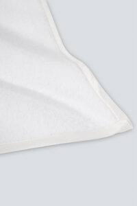 Aqua Bath Towel corner close-up with silk edging, showing smooth stitching and premium fabric texture.