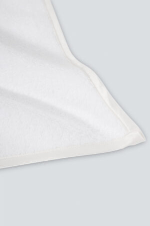 Aqua Bath Towel corner close-up with silk edging, showing smooth stitching and premium fabric texture.