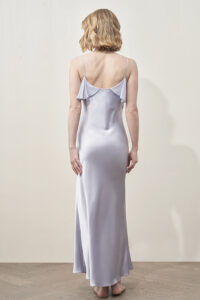 Back full-body view of MANITO Aurora Silk Nightdress in lavender, emphasizing flattering cut and smooth silhouette.