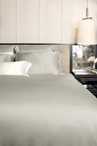 MANITO Authentic Silk Duvet Cover in quartz grey showcased in a sophisticated bedroom setting.