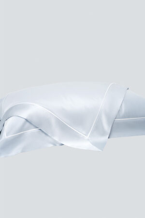Light blue MANITO Authentic Silk Pillowcase Set shown individually, highlighting the smooth drape of silk.