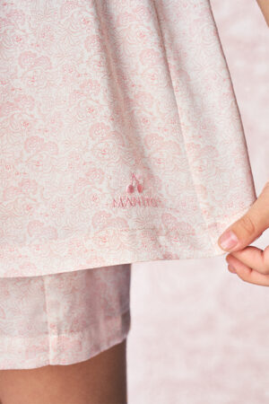 Close-up of BONPOINT×MANITO Ailette Kid's Pajama Set Gift Box logo embroidered on soft pink mulberry silk fabric.