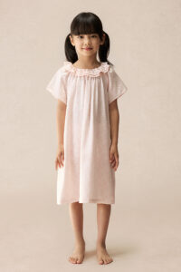 Full front view of girl wearing BONPOINT×MANITO Celestial Kid's Nightdress, showcasing relaxed fit and soft floral print.