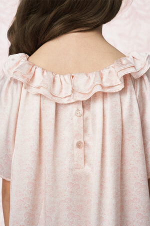 Back detail of BONPOINT×MANITO Celestial Kid's Nightdress Gift Box showing ruffled collar and pearl-like button closure.