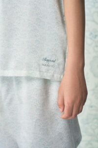 Detail of BONPOINT×MANITO Clive Kid's Pajama Set Gift Box showing logo embroidery.