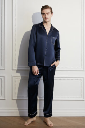 Mature man wearing the Liberty navy blue silk men's pajama set with contrast piping.