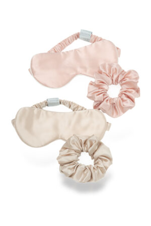 Bestie Gift Box silk eye mask and scrunchy sets in blush pink and champagne arranged together.