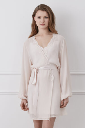 Woman posing in a pink Latica Lace-trimmed Silk Robe, highlighting the intricate lace detailing and satin sash.
