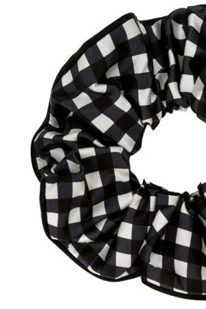 Detail shot of the black gingham silk scrunchie from the Blooming Gift Box.