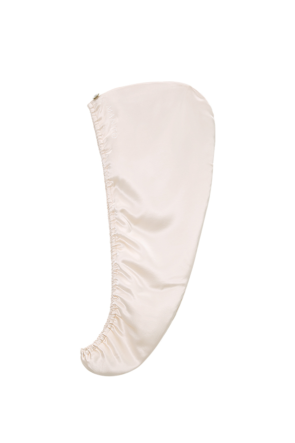 Blooming Silk Hair Turban displayed side view to highlight its smooth ballet-pink mulberry silk finish.