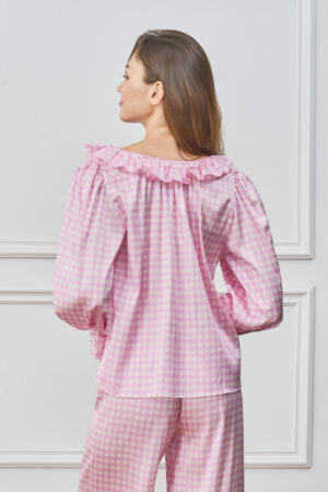 Back view of woman in pink Blooming Women's Pajama Set, showing ruffled neckline and relaxed drape of the top.
