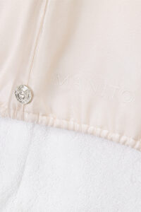 Button and MANITO embroidery detail on Blush Bath Gift Set hair wrap.
