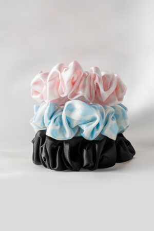 3 Pack Large Silk Scrunchie Set stacked in blue, pink, and black, combining softness and style for daily wear.