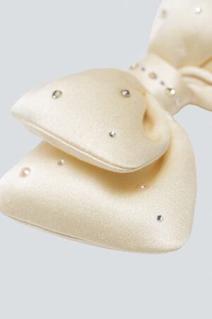 Detailed close-up of a Yellow Calla Silk Scented Sachet bow with diamond embellishments.