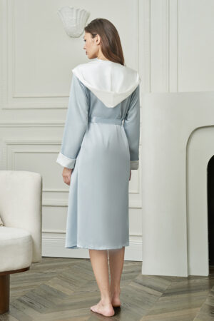 Back view of Calla Women's Hooded Bathrobe in baby blue, highlighting the elegant draped hood and flowing silk finish.
