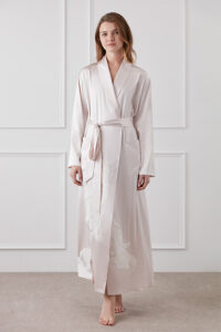 Model wearing MANITO Camellia Silk Long Robe with elegant camellia embroidery and tie belt on front view.
