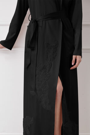 Close-up of black MANITO Camellia Silk Long Robe featuring delicate camellia embroidery and side slit design.