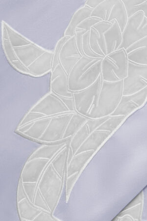 Detailed view of camellia embroidery on MANITO Camellia Silk Long Robe showing fine stitching and texture.