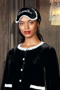 MANITO Charlotte Luxury Silk Eye Mask for Sleeping worn by woman.