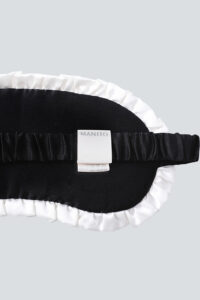 Back view of MANITO Charlotte Luxury Silk Eye Mask for Sleeping with Manito tag.