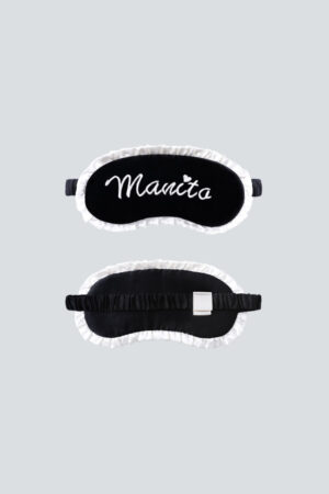 Front view and back view of MANITO Charlotte Luxury Silk Eye Mask for sleeping, featuring black silk velvet with white ruffle trim.